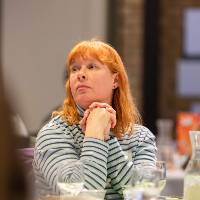 person at table listening photo 2